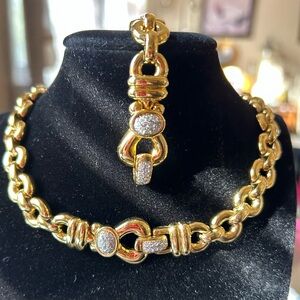 Elegant REPLICA gold tone necklace and bracelet set. CZ clasps. Signed